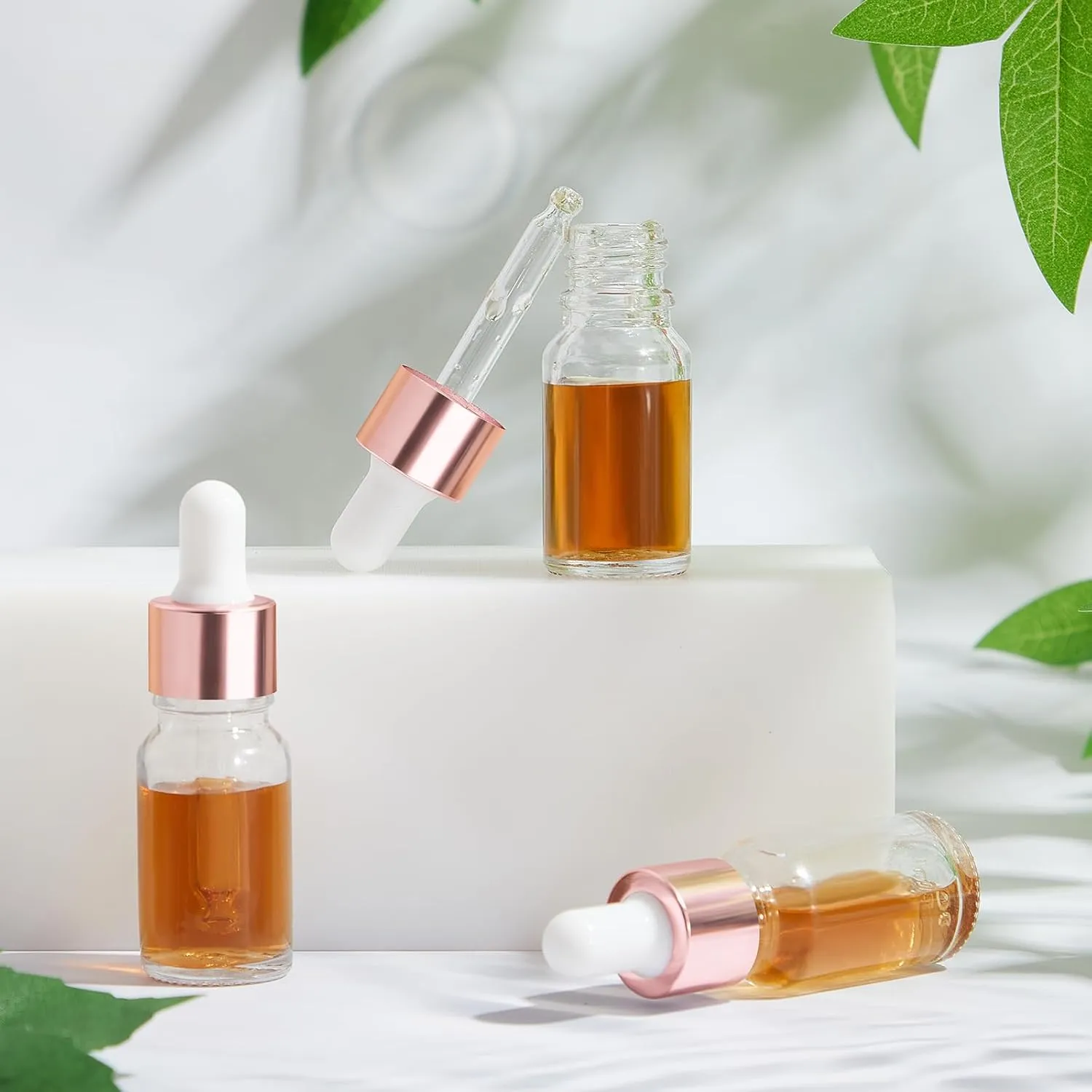100 Pcs Mini Glass Oil Dropper Bottle Bulk, 10 ml Rose Gold Clear Essential Small Empty Bottles Sample Containers Perfume Liquid Vials with Cap for Traveling